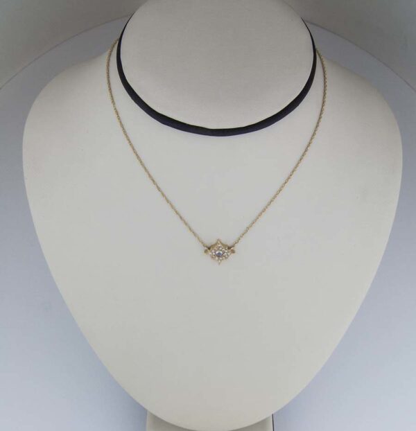 18K YG “starburst” pendant with rose cut, and round brilliant cut pave diamonds.