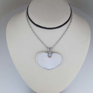 18k mother of pearl heart with a diamond cage
