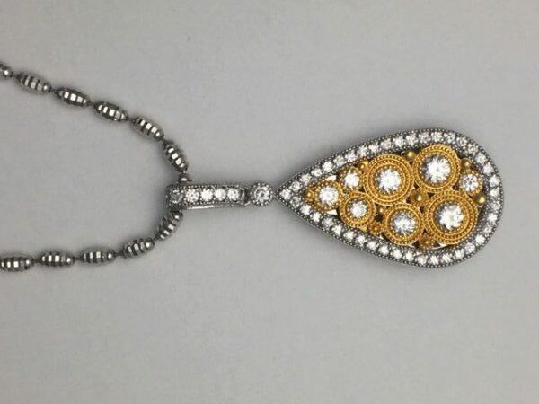 18k white and yellow gold pendant with diamonds-completely handmade Pendant has .83 carats of round brilliant cut diamonds.