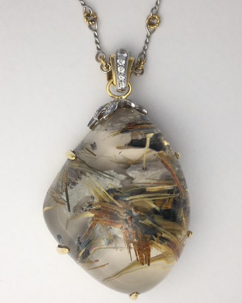 One of a kind necklace with amazing Rutilated Quartz set in 18k and diamonds. The chain is completely handmade and is 18kt white and yellow gold